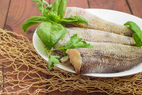 Carcasses of the notothenia fish prepared for cooking closeup photo