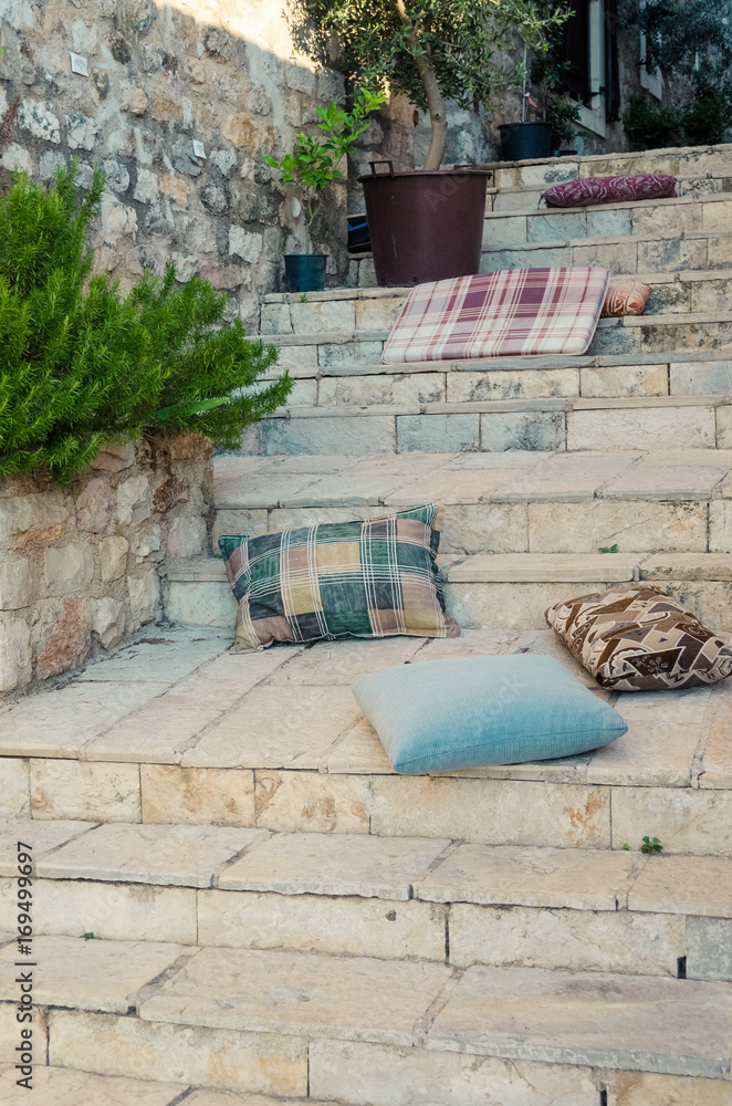 Stairs with pillows and stone arch in Ulcinj Old Town, Montenegro. Stairs with pillows and stone arch in Ulcinj Old Town, Montenegro.