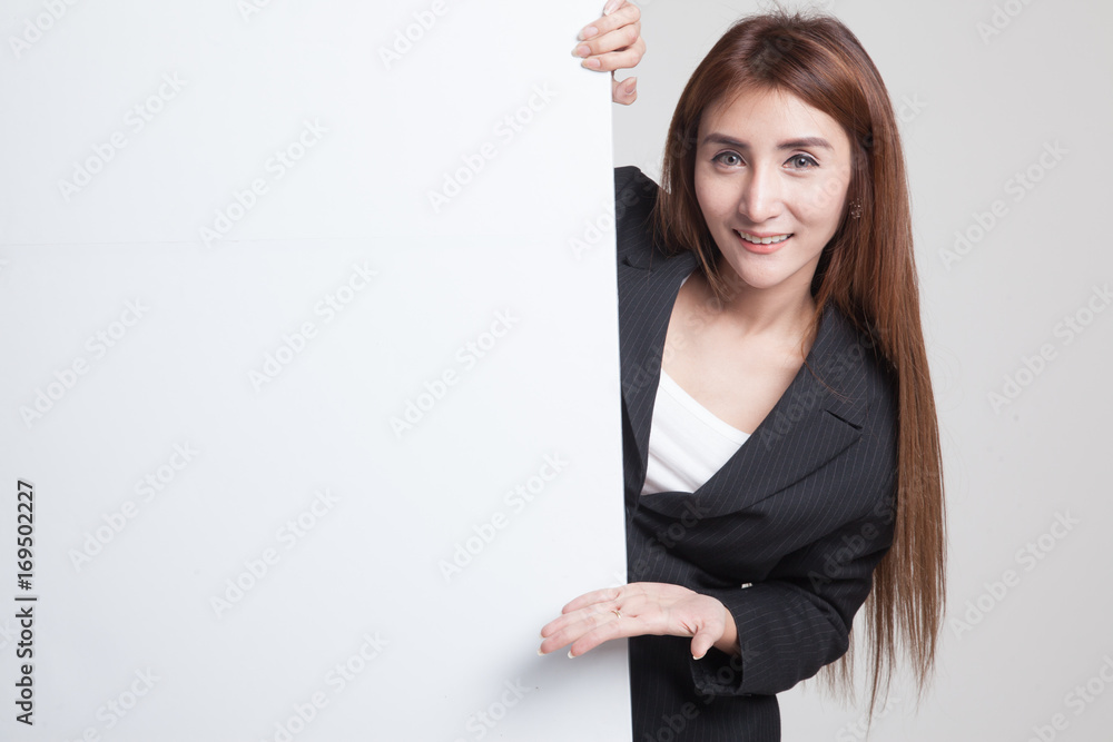 Young Asian woman present blank sign with palm hand. Young Asian woman present blank sign with palm hand.
