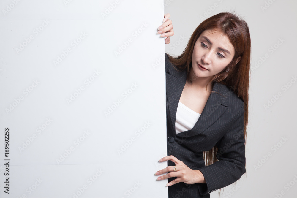 Young Asian woman with blank sign.