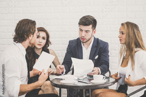 Business People Working Together with Serious emotion. Business People takling in modern office. Business people Working concept. Vintage color tone photo