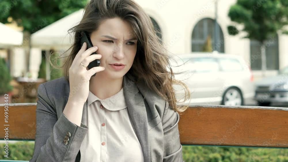 Attractive businesswoman talking on cellphone and checking papers, steadycam shot
Attractive businesswoman talking on cellphone and checking papers, steadycam shot