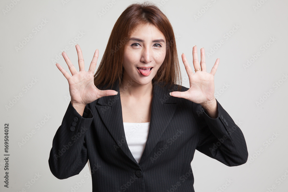 Young Asian woman sticking her  tongue out.