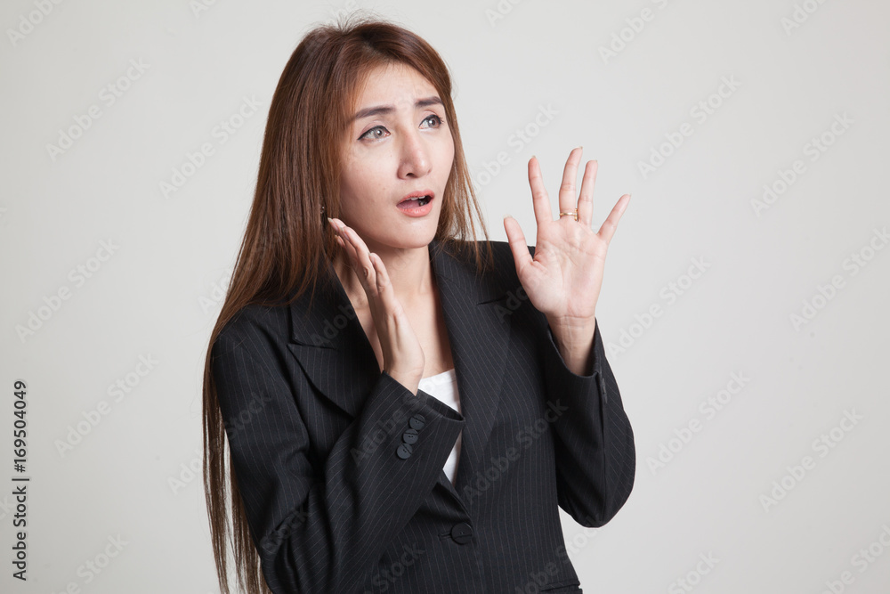 Beautiful young Asian woman shocked and look up. Beautiful young Asian woman shocked and look up.