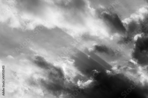 A close view of clouds with sun rays coming out through them