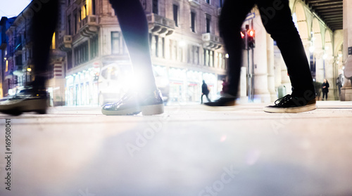 People walking on the street at night in Turin Italy