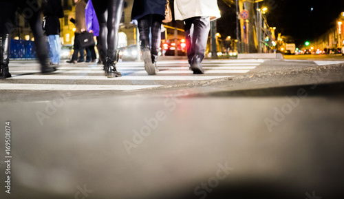 People walking on the street at night in Turin Italy