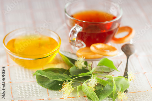 Tea with flowers of a linden and white honey