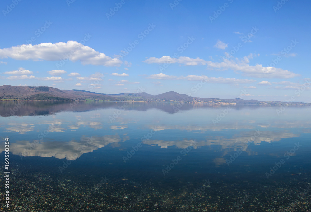 Lake Bracciano, Italy, mirror reflection of the sky in the water