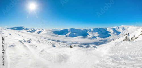 Panorama of white winter mountains