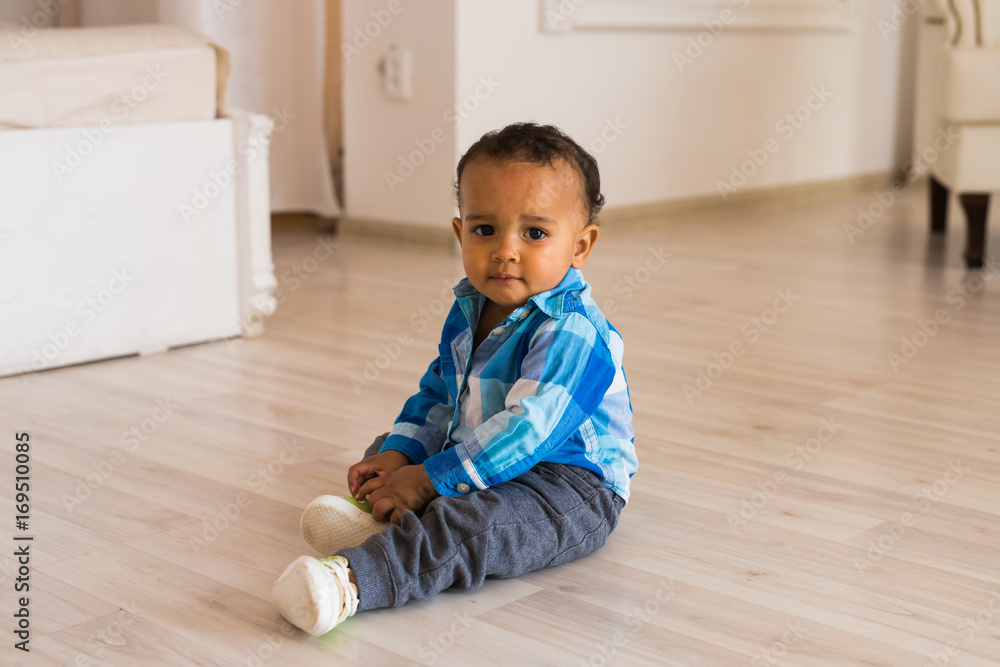 Portrait of a little african american baby boy playing indoor Portrait of a little african american baby boy playing indoor