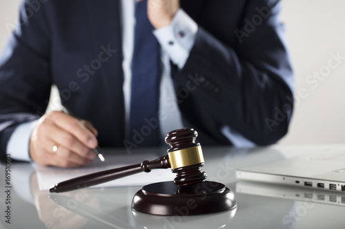 Lawyer concept. Law firm. Man signing agreement. Legal office.