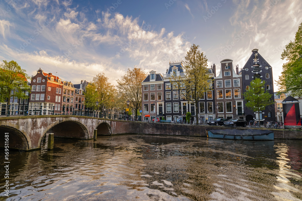 Fototapeta premium Amsterdam city skyline at canal waterfront, Amsterdam, Netherlands