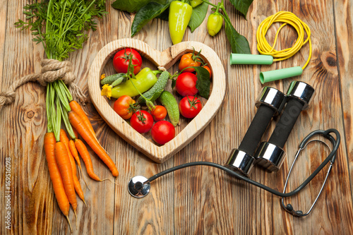 Vegetables in the heart. Diet, healthy lifestyle on a rustic wooden background