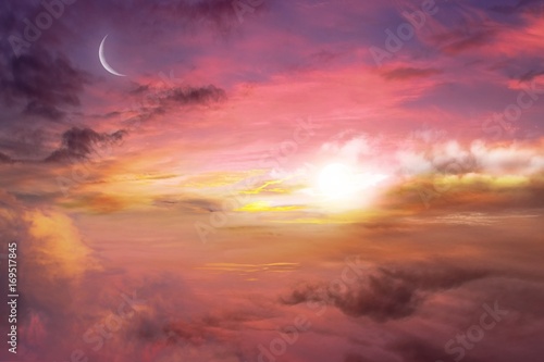 Dawn and pink clouds with the moon . Sunset and new moon . Light in dark sky . beautiful cloud .  Religion background . Muslim community festival  Mubarak background .