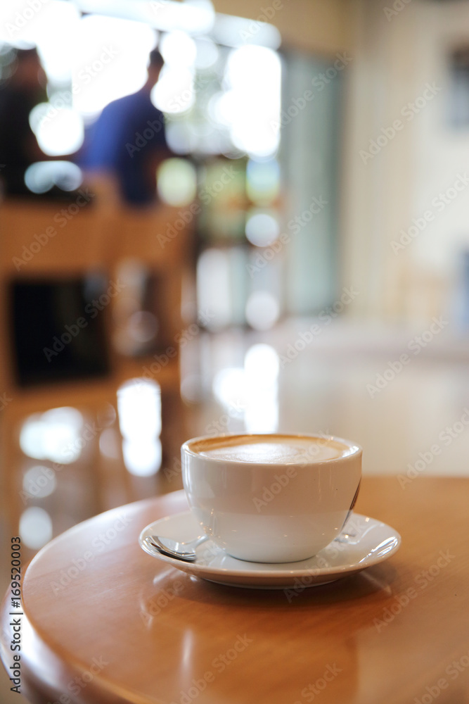 cappuccino coffee on wood background