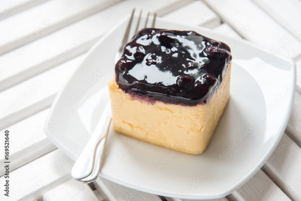 Blueberry Cheesecake close up pie on white wooden table, sweet dessert. Blueberry Cheesecake close up pie on white wooden table, sweet dessert.