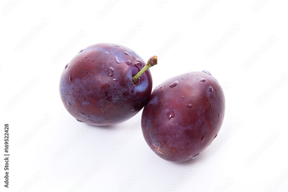 Group of ripe plums isolated on a white background..