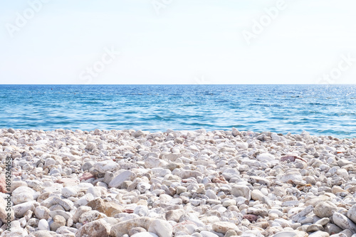 View of blue sea and rocky shore