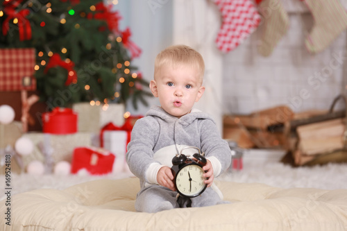 Cute little baby with clock...