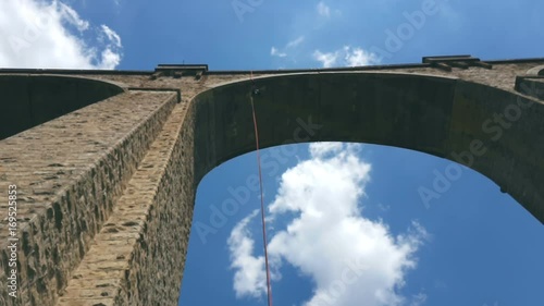 Descending by rope from the Bunovo Bridge near Sofia. photo