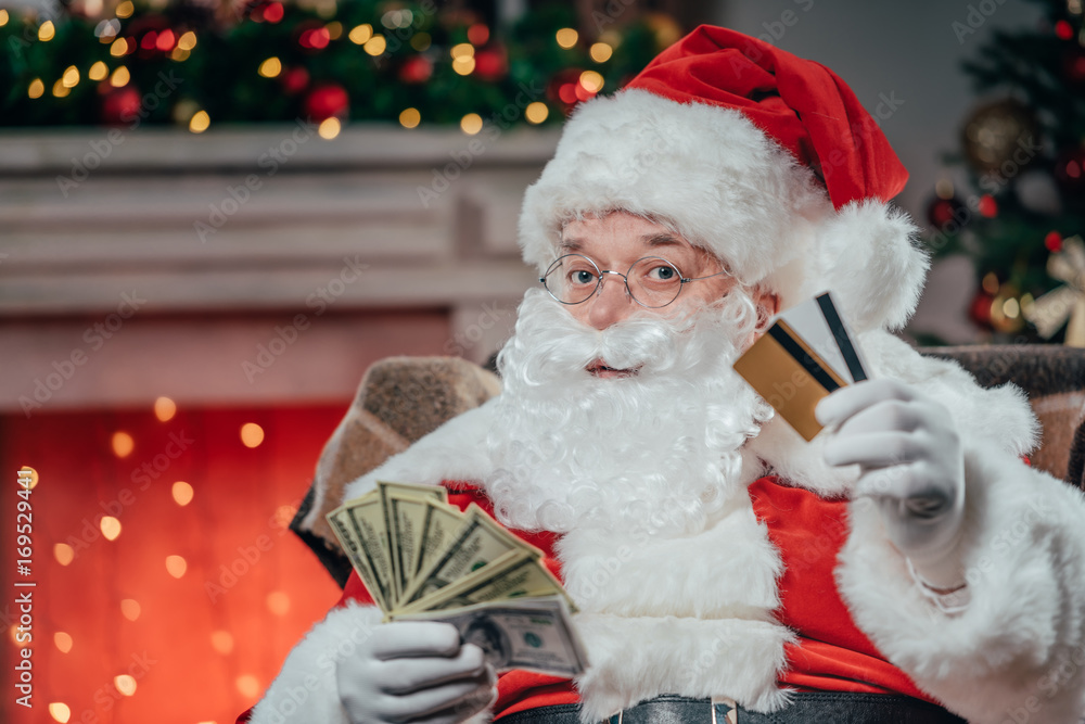 santa with credit cards and dollars santa with credit cards and dollars
