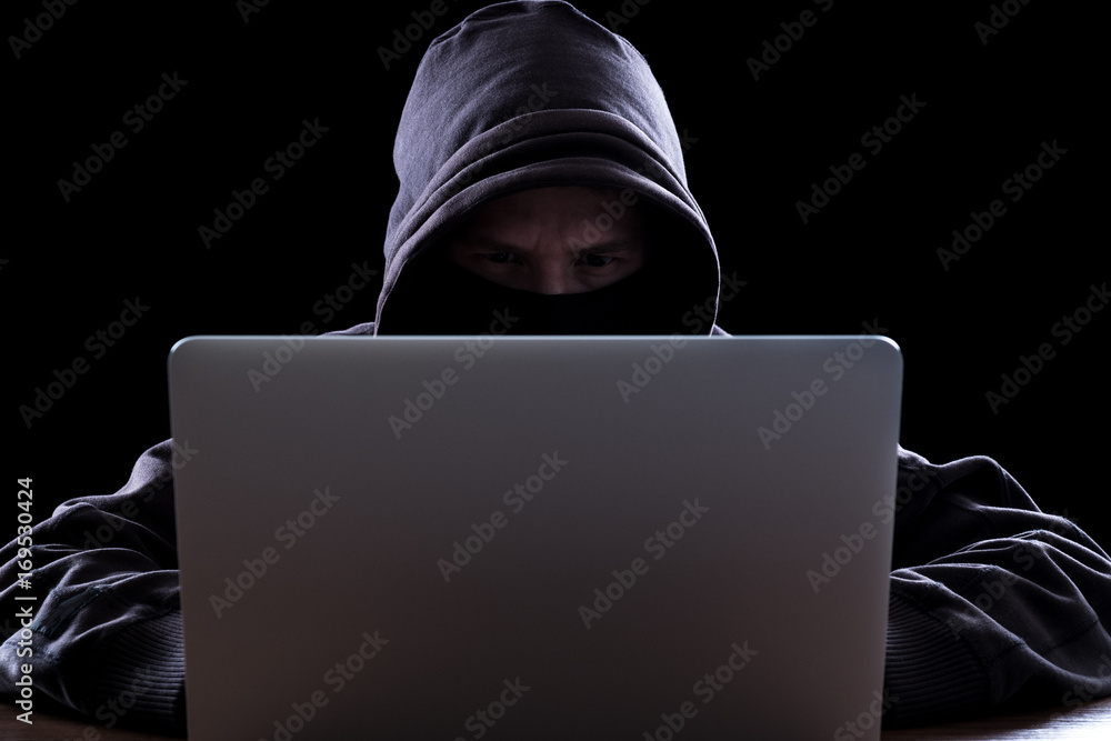 Anonymous hacker in the dark Anonymous hacker in the dark
