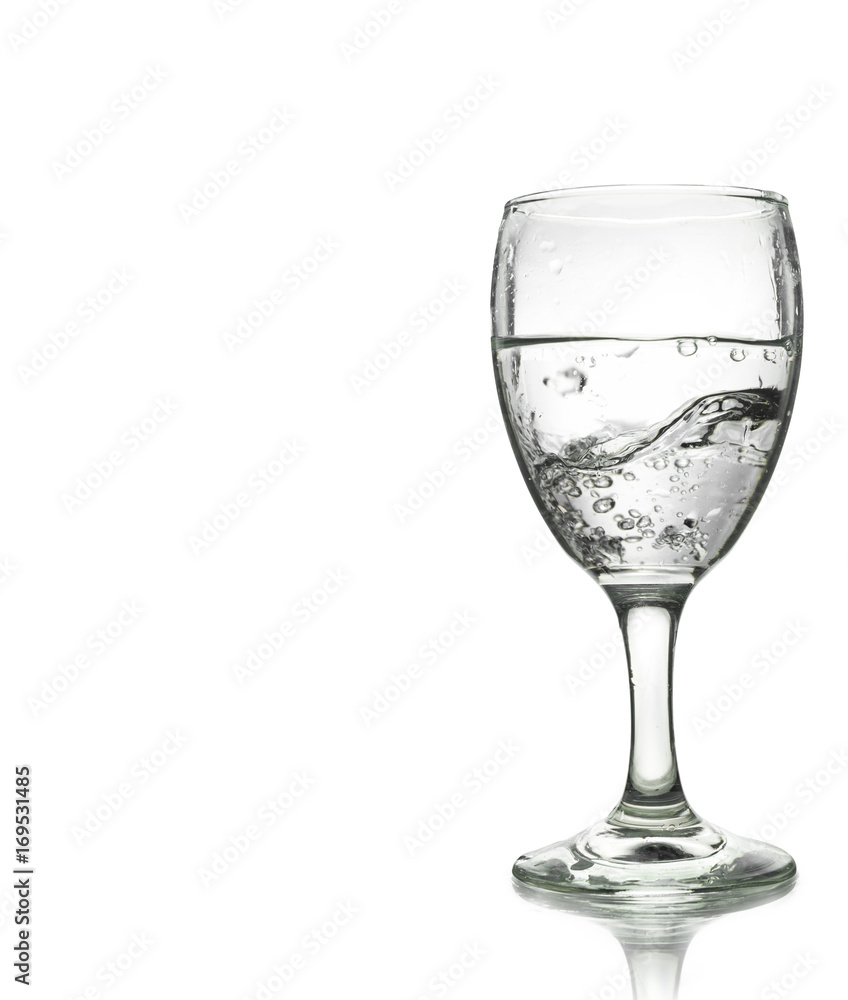 pouring water on a glass isolated on white background. Clipping path