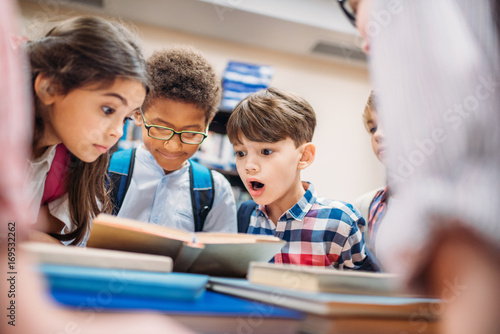 children looking at book