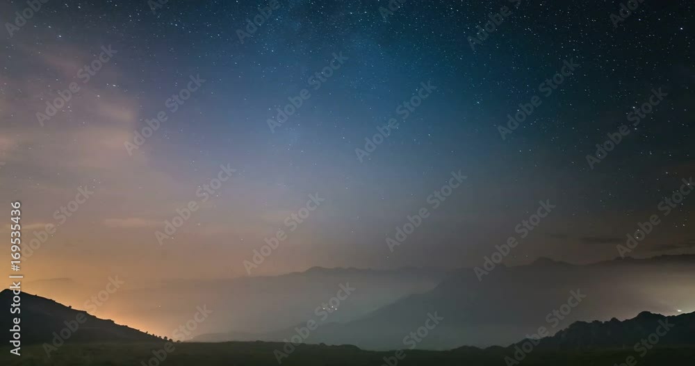 Time Lapse of the Milky way and the starry sky moving over the Italian Alps with fog and moisture resulting in a dreamlike effect. Glowing valleys below. Static version.
Time Lapse of the Milky way and the starry sky moving over the Italian Alps with fog and moisture resulting in a dreamlike effect. Glowing valleys below. Static version.