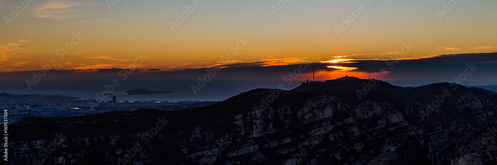 sunset over the city of Marseille and the massif de l'Étoile