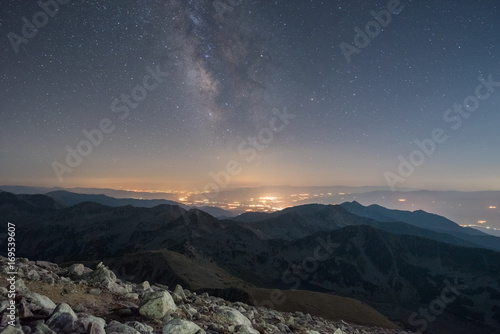 The Milky Way at night from a mountain top - typical image of solitude, relaxation and reaching high peaks © photoenthusiast