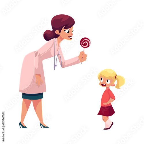 Young woman doctor, pediatrician in stethoscope giving lollipop candy to little girl, cartoon vector illustration isolated on white background. Woman doctor pediatrician giving lollipop to little girl