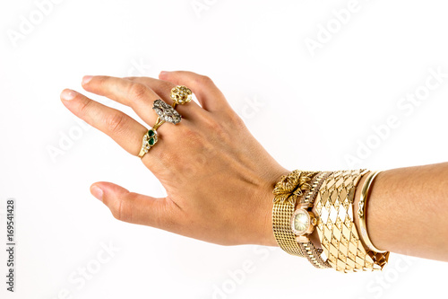 female wrist with jewelry on white background