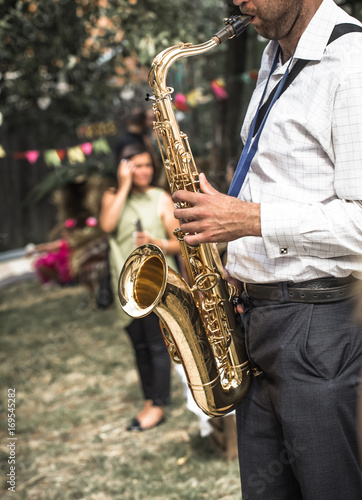a man plays the saxophone