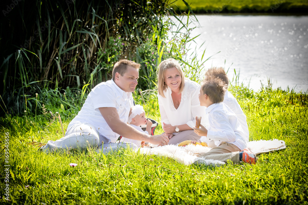 Family in white clothes, picnic in nature Family in white clothes, picnic in nature