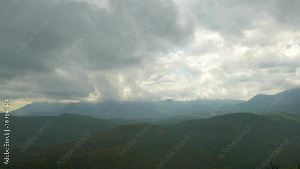 Rain clouds over green mountains, time lapse / Rain clouds over green mountains covered with forests, time lapse Rain clouds over green mountains, time lapse / Rain clouds over green mountains covered with forests, time lapse