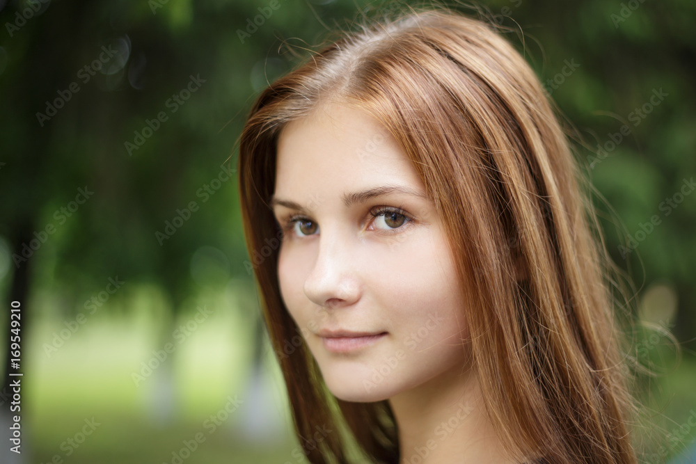 Close up portrait of young beautiful girl with long brown hair