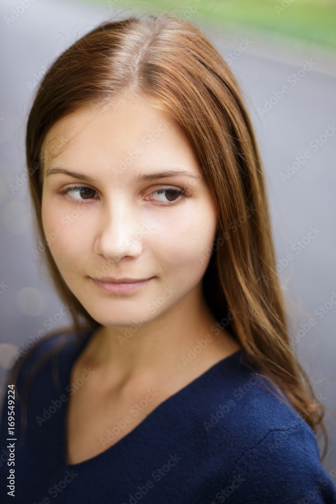 Close up portrait of young beautiful girl with long brown hair Close up portrait of young beautiful girl with long brown hair