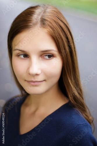 Close up portrait of young beautiful girl with long brown hair