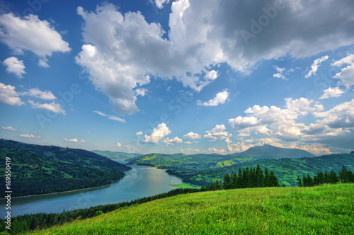 meadow and lake landscape in Stanisoarei mountains, Romania