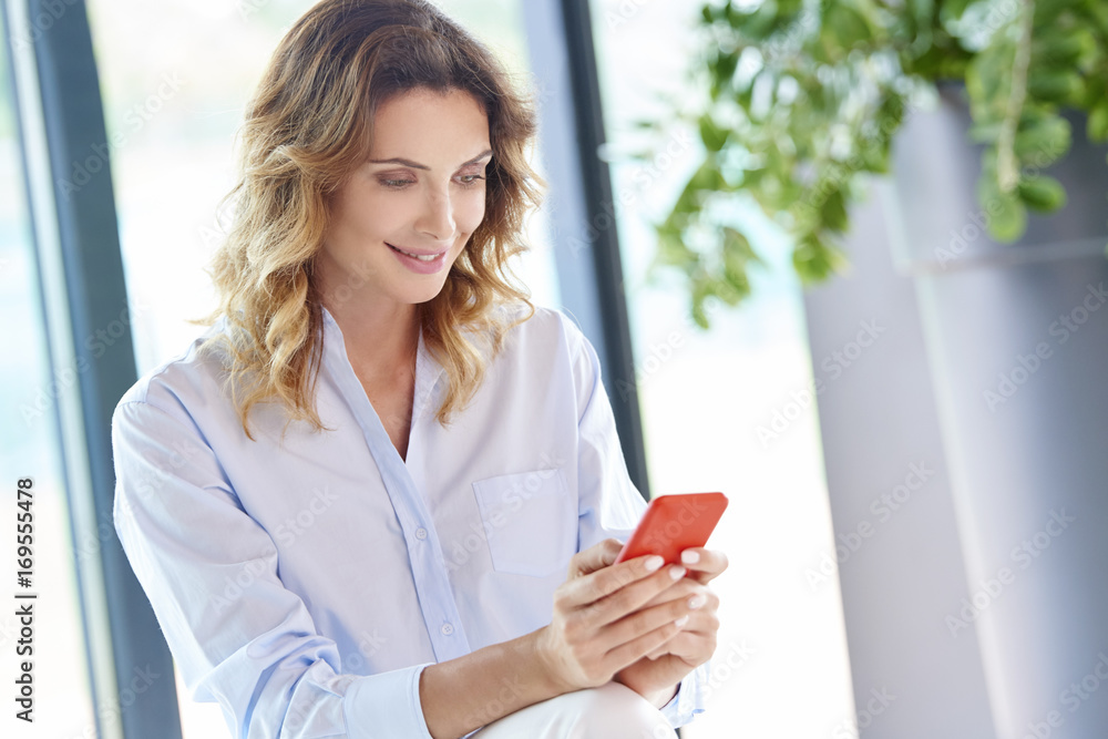 Woman using her mobile phone and send text messages. Woman using her mobile phone and send text messages.