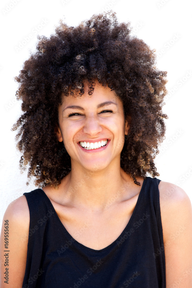 Close up attractive woman laughing by white background Close up attractive woman laughing by white background