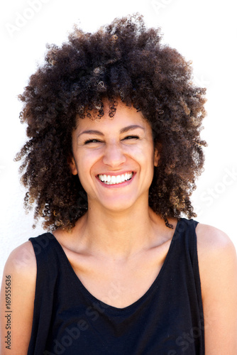 Close up attractive woman laughing by white background