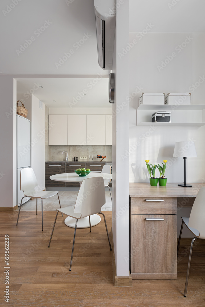 Fototapeta premium Interior of modern apartment in scandinavian style with kitchen and workplace.