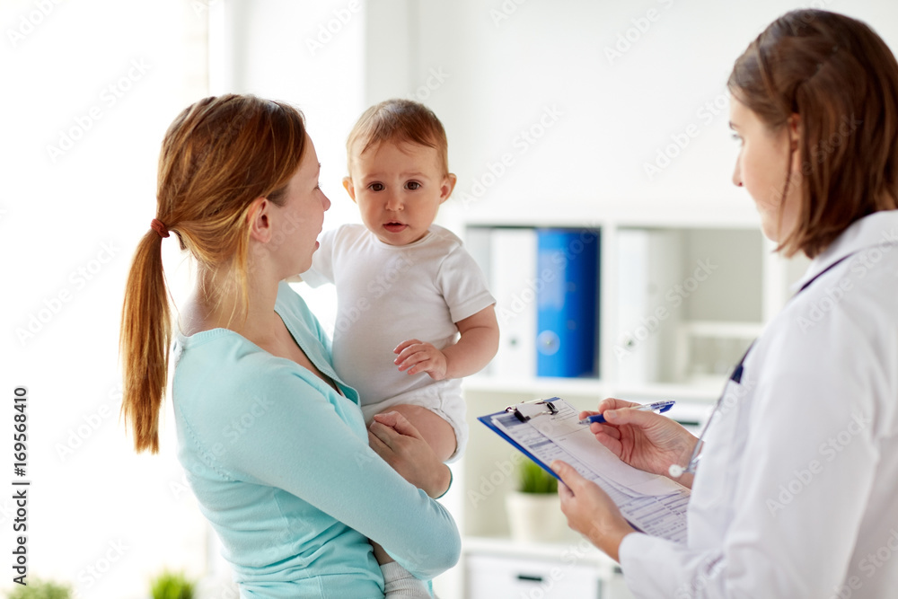 Fototapeta premium happy woman with baby and doctor at clinic