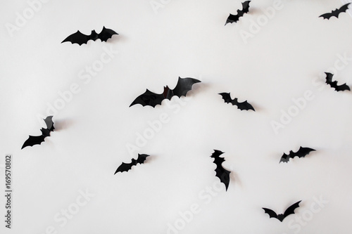 black paper bats over white background © Syda Productions