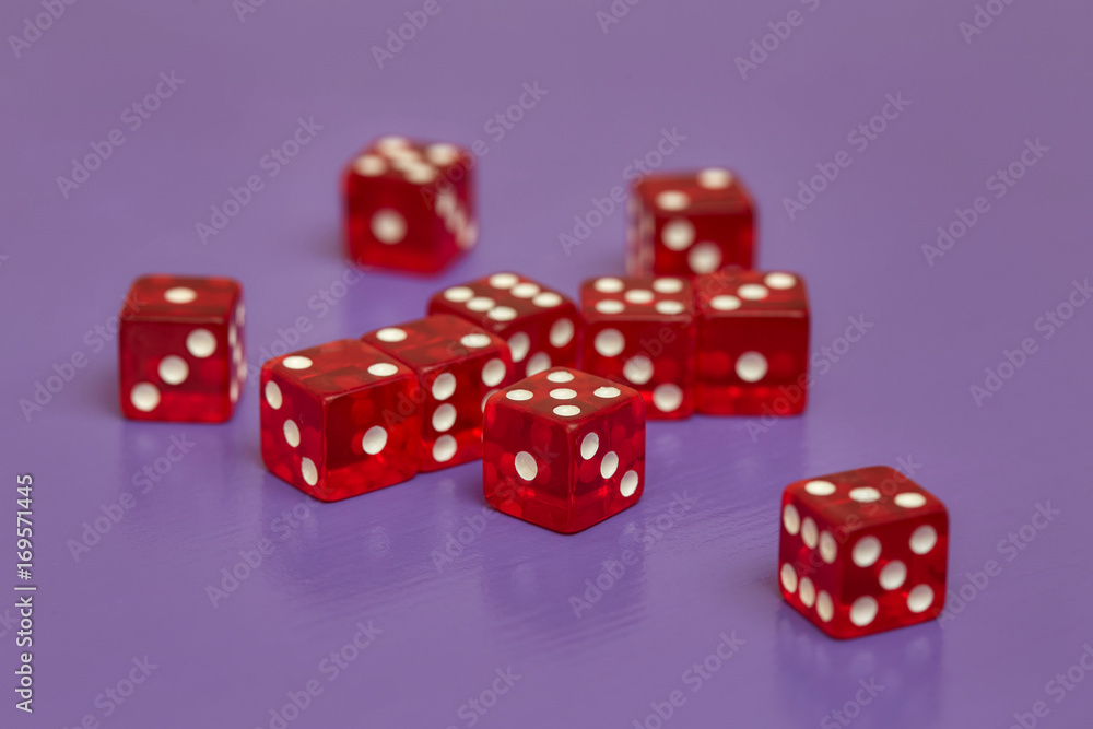 Group of red dices on purple background Group of red dices on purple background
