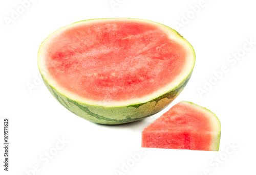 Half watermelon with slice