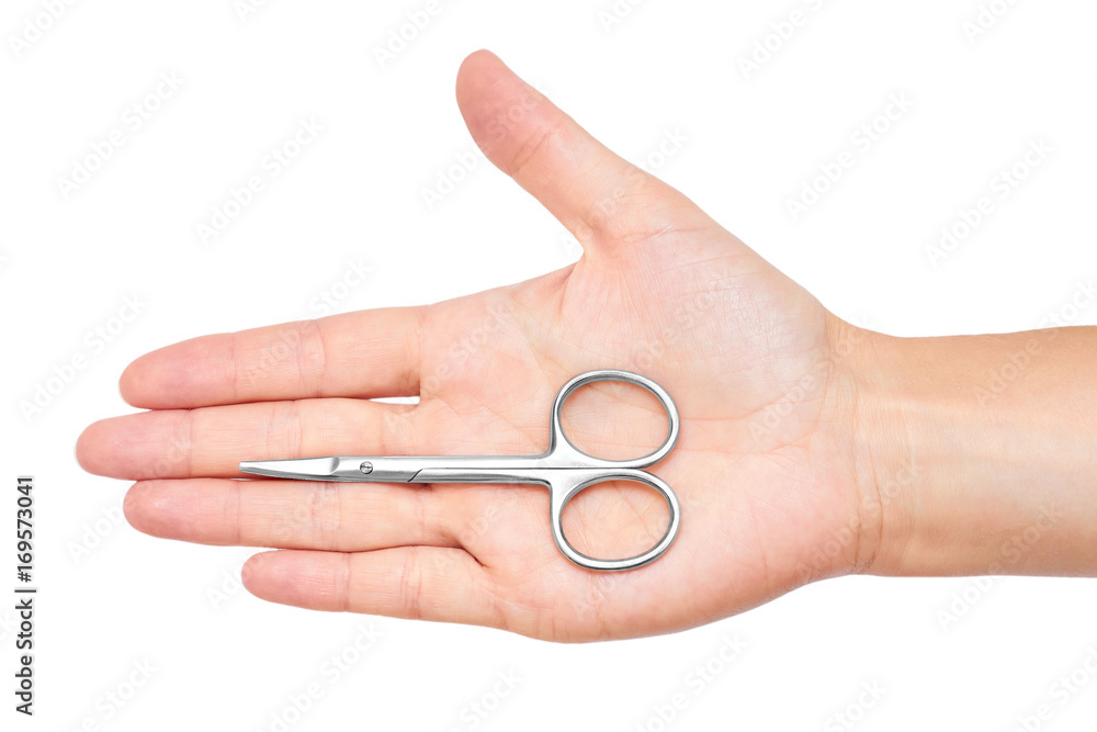 manicure scissors in hand isolated on white background manicure scissors in hand isolated on white background